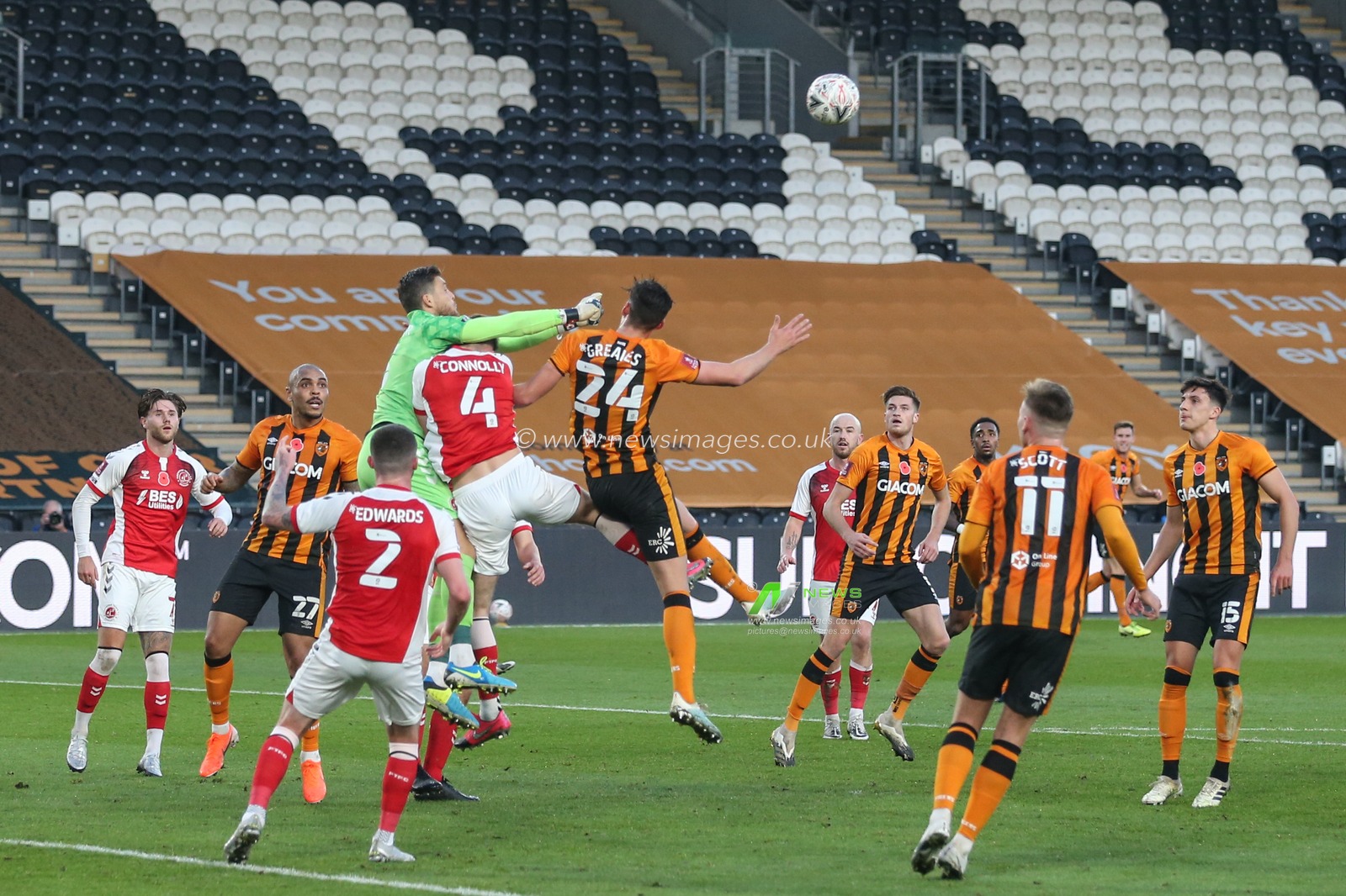Jayson Leutwiler #13 of Fleetwood Town punches the ball clear