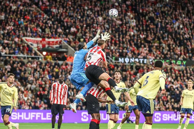 Arsenal goalkeeper David Raya and Daniel Ballard of Sunderland battle for the high ball during the Premier League match Sunderland vs Arsenal at Stadium Of Light, Sunderland, United Kingdom on 12 September 2026

(Photo by Alfie Cosgrove/News Images)