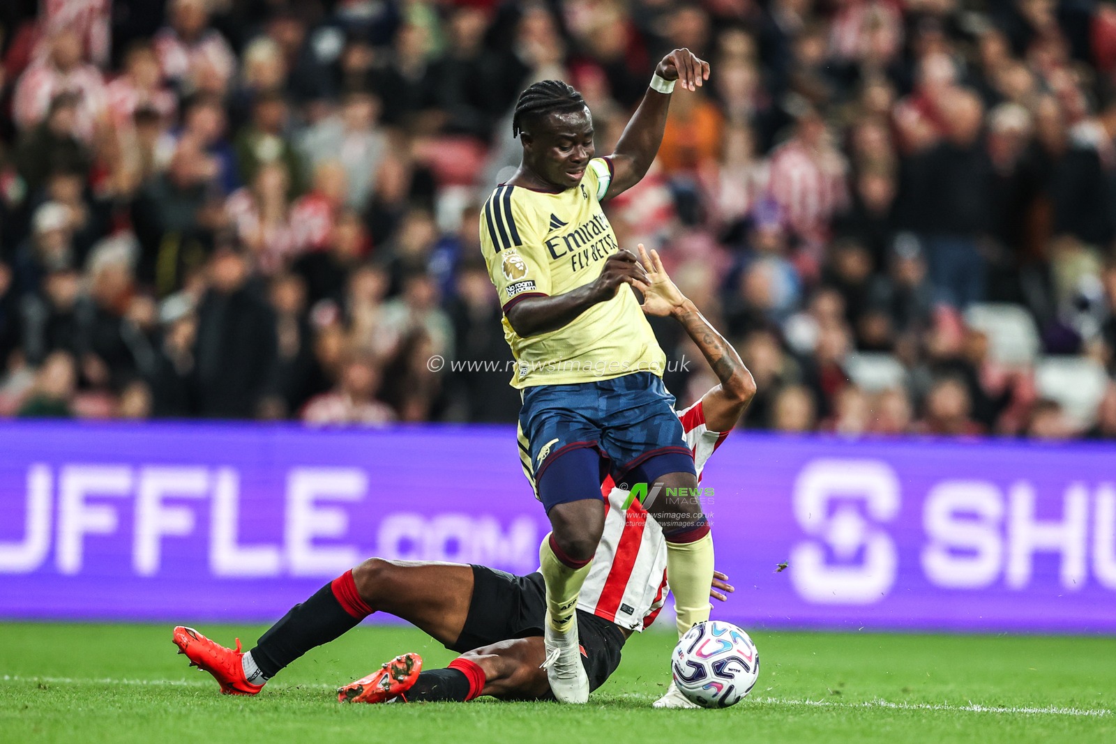 Bukayo Saka of Arsenal is fouled in the box by Reinildo Mandava of Sunderland to award a penalty to Arsenal during the Premier League match Sunderland vs Arsenal at Stadium Of Light, Sunderland, United Kingdom on 12 September 2026

(Photo by Alfie Cosgrove/News Images)