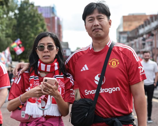 Manchester United fan make their way to the game during the Premier League match Manchester United vs Manchester City at Old Trafford, Manchester, United Kingdom on 13 September 2026

(Photo by Mark Cosgrove/News Images)