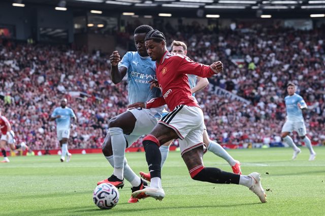 Marcus Rashford of Manchester United is tackled by Marc Guehi of Manchester City during the Premier League match Manchester United vs Manchester City at Old Trafford, Manchester, United Kingdom on 13 September 2026

(Photo by Mark Cosgrove/News Images)