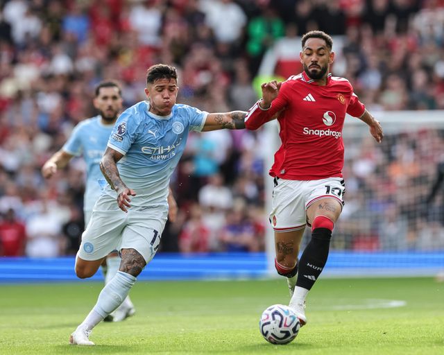 Enzo Fernandez of Manchester City and Matheus Cunha of Manchester United battle for the ball during the Premier League match Manchester United vs Manchester City at Old Trafford, Manchester, United Kingdom on 13 September 2026

(Photo by Mark Cosgrove/News Images)