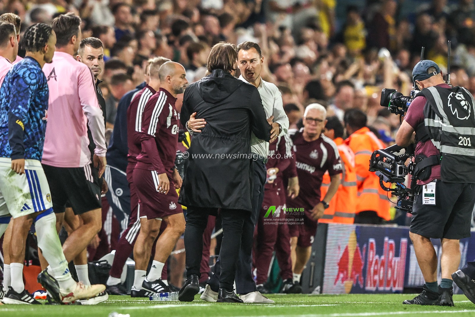 Daniel Farke manager of Leeds United embraces Matthias Jaissle manager of Newcastle United after the game during the Premier League match Leeds United vs Newcastle Untied at Elland Road, Leeds, United Kingdom on 14 September 2026

(Photo by Alfie Cosgrove/News Images)