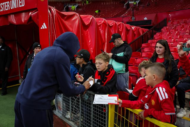 Georginio Rutter of Brighton & Hove Albion signs autographs for young fans during the Carabao Cup round 3 match Manchester United vs Brighton & Hove Albion at Old Trafford, Manchester, United Kingdom on 16 September 2026

(Photo by Mark Cosgrove/News Images)