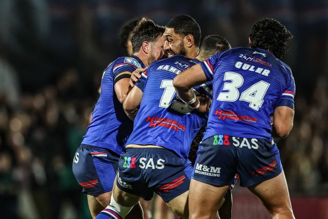 Isaac Liu of Leigh Leopards is tackled by Caleb Hamlin-Uele of Wakefield Trinity during the Betfred Super League Play-off Eliminator round match Wakefield Trinity vs Leigh Leopards at DIY Kitchens Stadium, Wakefield, United Kingdom on 18 September 2026

(Photo by Alfie Cosgrove/News Images)