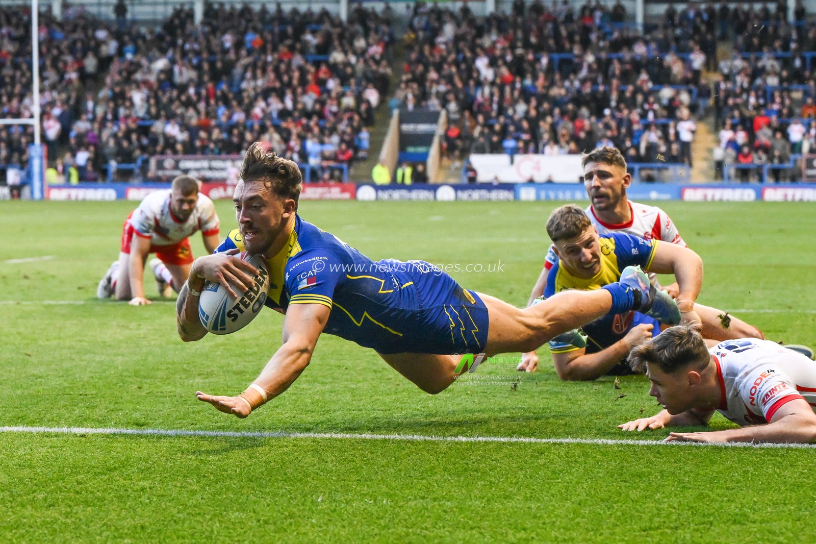 Matty Ashton of Warrington Wolves goes over for a try during the Betfred Super League play-off Eliminator 2 Warrington Wolves v St Helens at Halliwell Jones Stadium, Warrington, United Kingdom, 28th September 2024

(Photo by Craig Thomas/News Images)