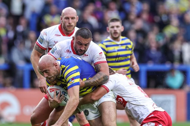 James Harrison of Warrington Wolves is tackled by Elliot Minchella of Hull KR and Jez Litten of Hull KR during the Betfred Super League Play-off Eliminator round match Warrington Wolves vs Hull KR at The Halliwell Jones Stadium, Warrington, United Kingdom on 19 September 2026

(Photo by Mark Cosgrove/News Images)