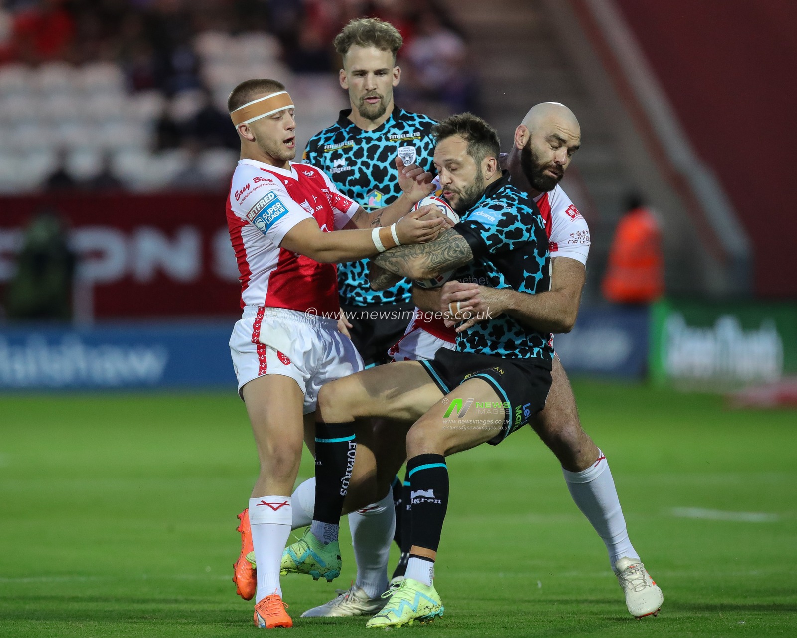 Gareth Obrein #17 of Leigh Leopards is tackled by Mikey Lewis #20 of Hull KR and Kane Linnett #12 of Hull KR during the Betfred Super League Round 23 match Hull KR vs Leigh Leopards at Sewell Group Craven Park, Kingston upon Hull, United Kingdom, 25th August 2023

(Photo by James Heaton/News Images)