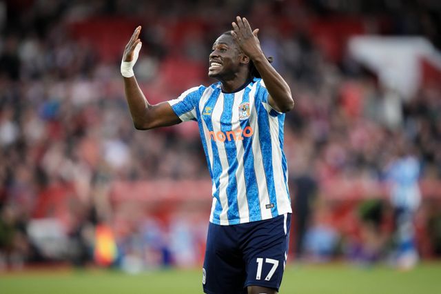 Loum Tchaouna of Coventry City celebrates Jay Dasilva of Coventry City scoring his goal to make it 0-1  during the Premier League match Nottingham Forest vs Coventry City at City Ground, Nottingham, United Kingdom on 19 September 2026

(Photo by Maynard Manyowa/News Images)