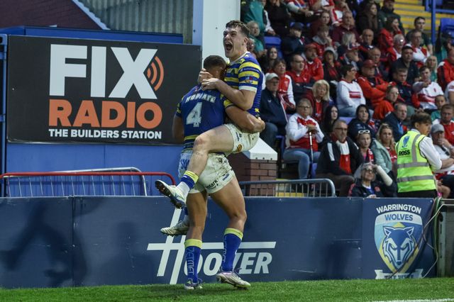 Albert Hopoate of Warrington Wolves celebrates his try with Josh Thewlis of Warrington Wolves during the Betfred Super League Play-off Eliminator round match Warrington Wolves vs Hull KR at The Halliwell Jones Stadium, Warrington, United Kingdom on 19 September 2026

(Photo by Mark Cosgrove/News Images)