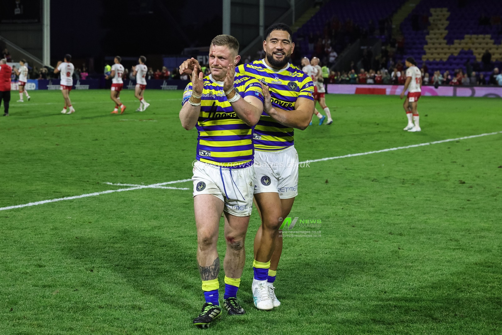 Luke Yates of Warrington Wolves and Kelepi Tanginoa of Warrington Wolves celebrate the win during the Betfred Super League Play-off Eliminator round match Warrington Wolves vs Hull KR at The Halliwell Jones Stadium, Warrington, United Kingdom on 19 September 2026

(Photo by Mark Cosgrove/News Images)