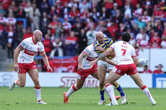 James Harrison of Warrington Wolves offloads during the Betfred Super League Play-off Eliminator round match Warrington Wolves vs Hull KR at The Halliwell Jones Stadium, Warrington, United Kingdom on 19 September 2026

(Photo by Mark Cosgrove/News Images)