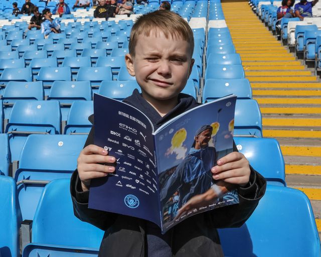 A young City fan reading the official match day program with Erling Haaland of Manchester City on the front cover during the Premier League match Manchester City vs Sunderland at Etihad Stadium, Manchester, United Kingdom on 20 September 2026

(Photo by Mark Cosgrove/News Images)