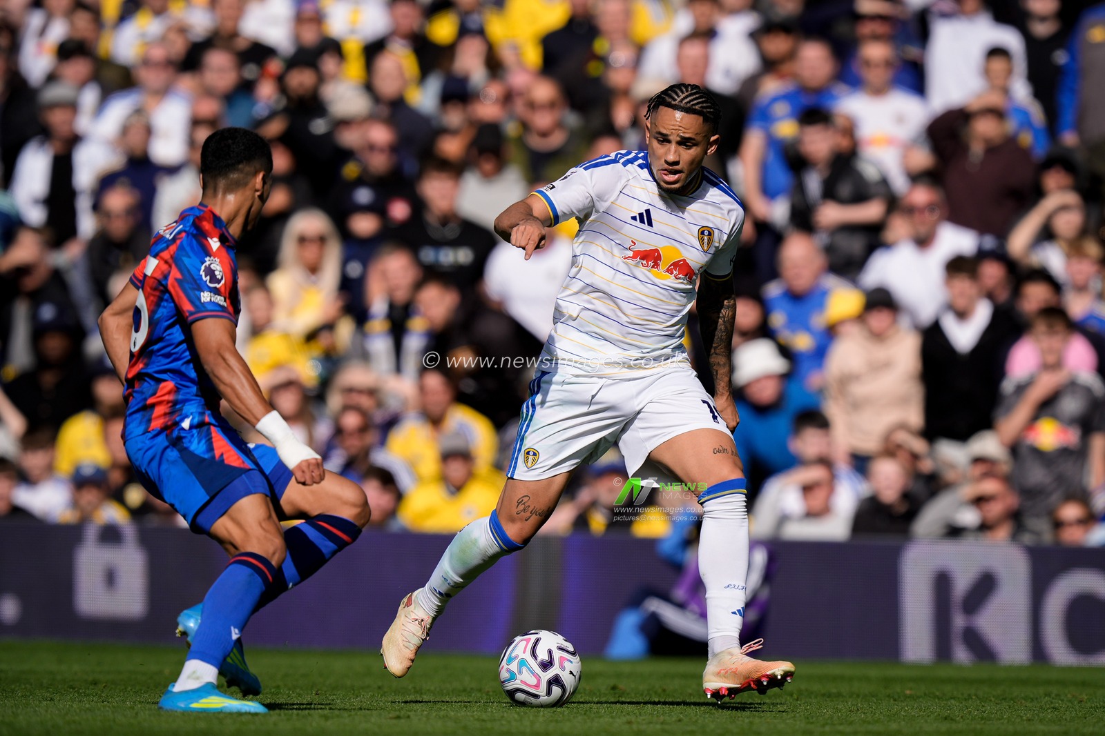 Noah Okafor of Leeds United dribbles past Anan Khalaili of Crystal Palace during the Premier League match Leeds United vs Crystal Palace at Elland Road, Leeds, United Kingdom on 20 September 2026

(Photo by Maynard Manyowa/News Images)