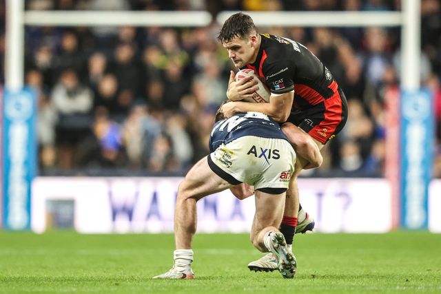 Albert Hopoate of Warrington Wolves is tackled by Ned McCormack of Leeds Rhinos during the Betfred Super League Play-off Semi-Final match Leeds Rhinos vs Warrington Wolves at AMT Headingley Stadium, Leeds, United Kingdom on 25 September 2026

(Photo by Alfie Cosgrove/News Images)