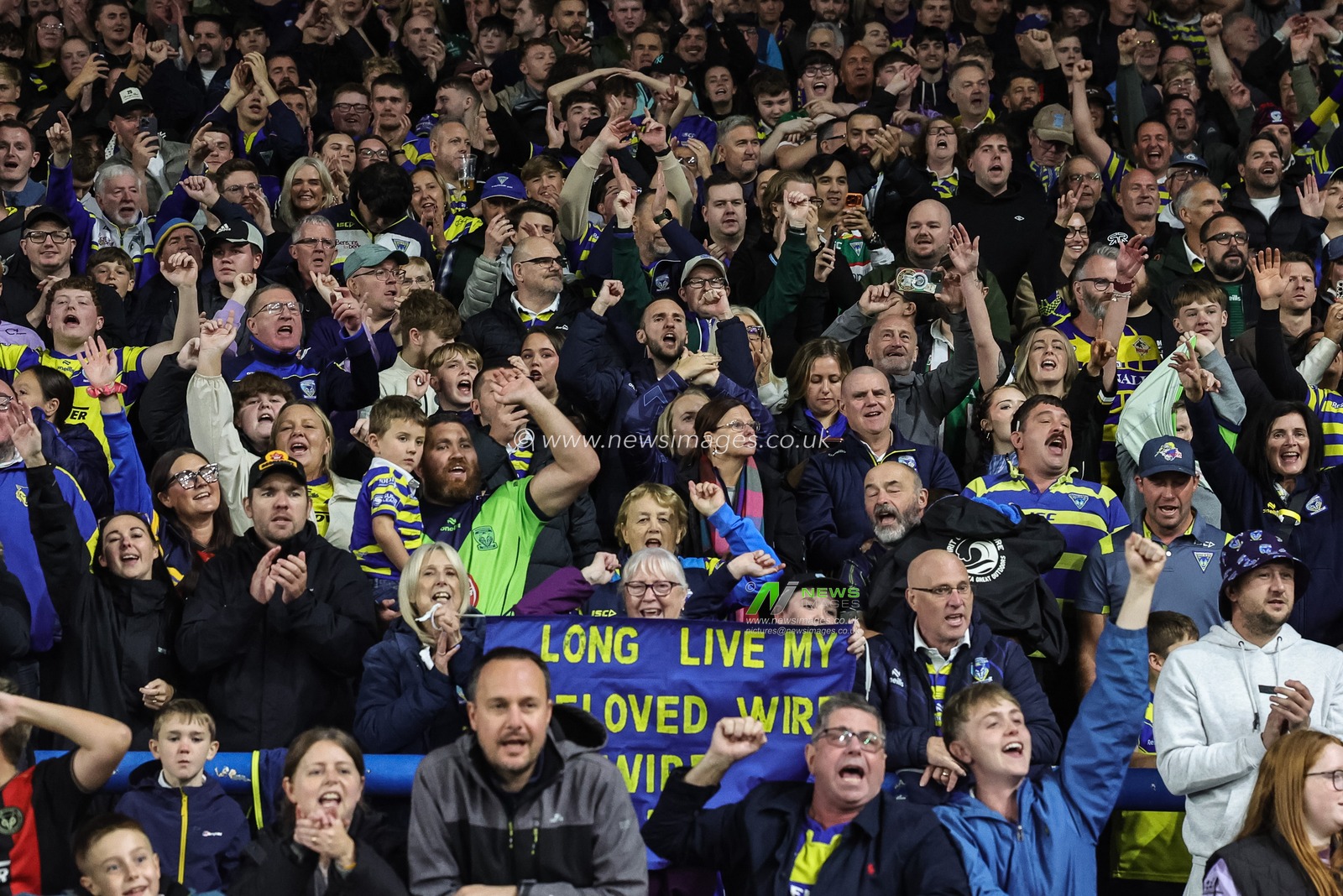 Warrington fans celebrate the win as they book their place in the final at Old Trafford during the Betfred Super League Play-off Semi-Final match Leeds Rhinos vs Warrington Wolves at AMT Headingley Stadium, Leeds, United Kingdom on 25 September 2026

(Photo by Mark Cosgrove/News Images)