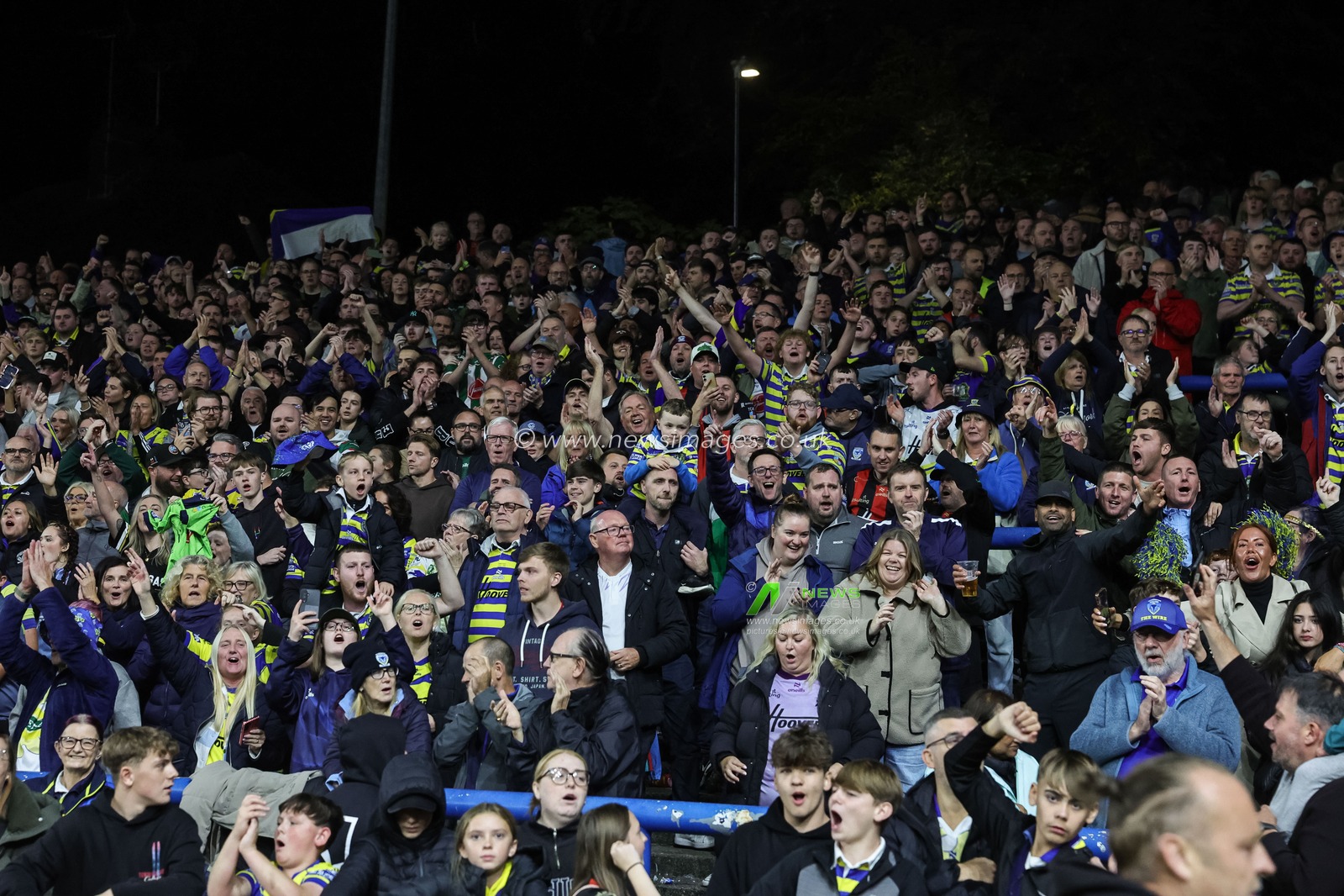 Warrington fans celebrate the win as they book their place in the final at Old Trafford during the Betfred Super League Play-off Semi-Final match Leeds Rhinos vs Warrington Wolves at AMT Headingley Stadium, Leeds, United Kingdom on 25 September 2026

(Photo by Mark Cosgrove/News Images)