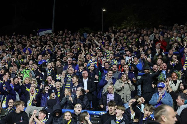 Warrington fans celebrate the win as they book their place in the final at Old Trafford during the Betfred Super League Play-off Semi-Final match Leeds Rhinos vs Warrington Wolves at AMT Headingley Stadium, Leeds, United Kingdom on 25 September 2026

(Photo by Mark Cosgrove/News Images)