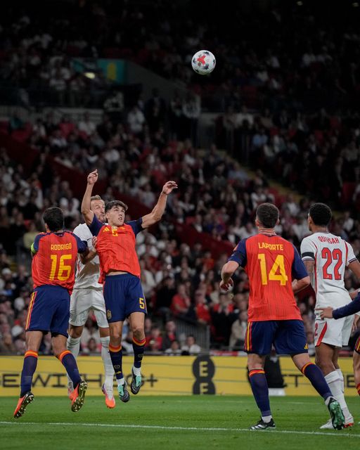 Harry Kane of England jumps up to win the high ball  against Pau Cubarsí of Spain during the UEFA Nations League match England vs Spain at Wembley Stadium, London, United Kingdom on 26 September 2026

(Photo by Maynard Manyowa/News Images)