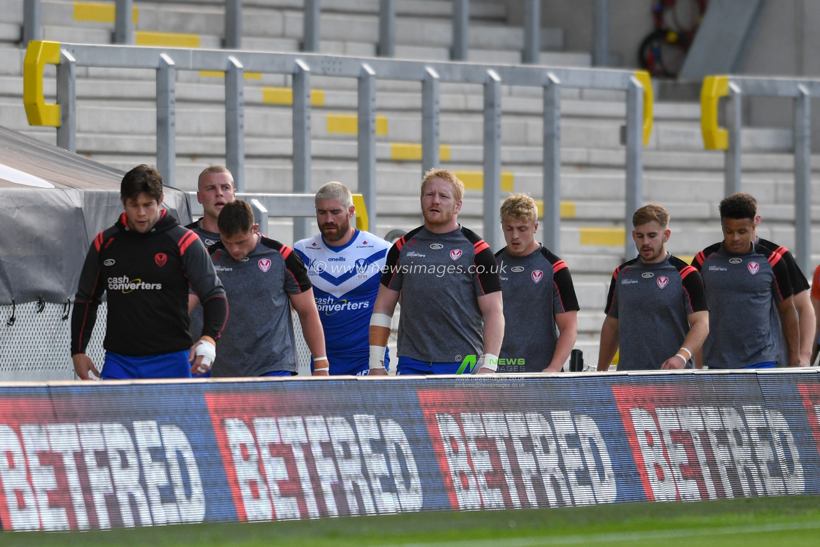 The St Helens team leave the pitch after their warm up