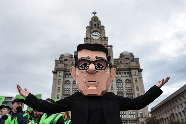 A young activist wearing a Papier-mache Andy Burnham The UK Prime Minister head protests outside the Royal Liver Building during the Labour Party Annual Conference 2026 at Convention Centre, Liverpool, United Kingdom on 27 September 2026

(Photo by Mark Cosgrove/News Images)