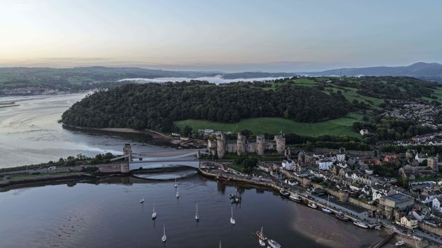 A spectacular sunrise breaks over the historic Conwy Castle, bathing the medieval fortress and surrounding landscape in dramatic golden light in Conwy, Wales, United Kingdom, on 3 October 2026.

(Photo by Mark Cosgrove/News Images)