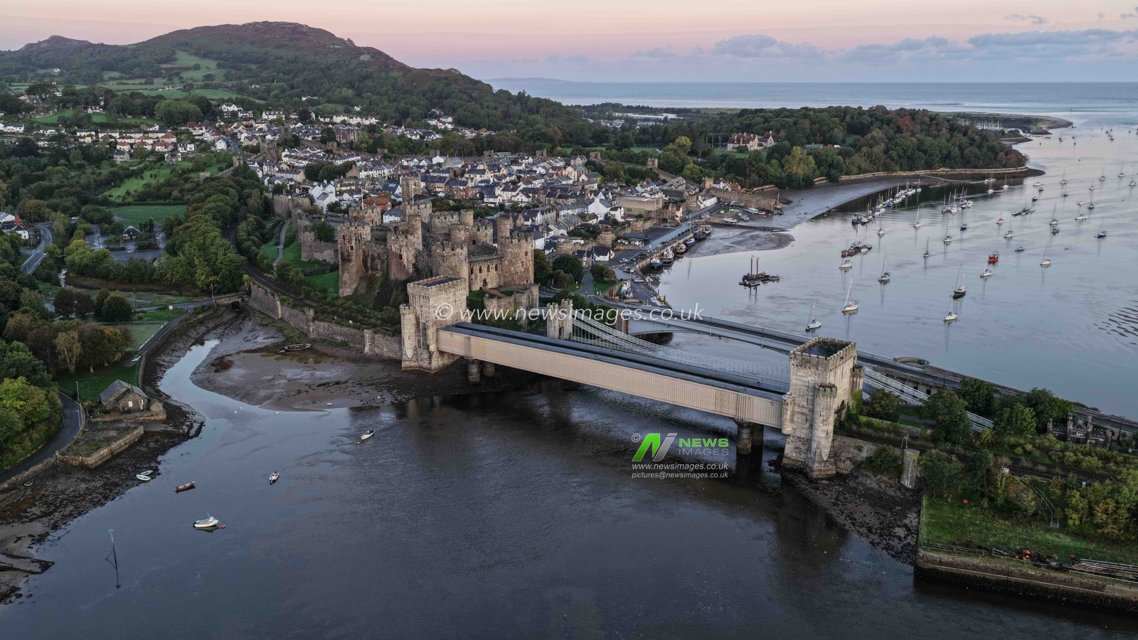 A spectacular sunrise breaks over the historic Conwy Castle, bathing the medieval fortress and surrounding landscape in dramatic golden light in Conwy, Wales, United Kingdom, on 3 October 2026.

(Photo by Mark Cosgrove/News Images)