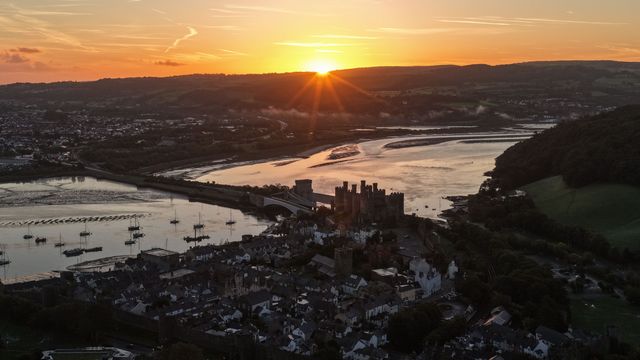 A spectacular sunrise breaks over the historic Conwy Castle, bathing the medieval fortress and surrounding landscape in dramatic golden light in Conwy, Wales, United Kingdom, on 3 October 2026.

(Photo by Mark Cosgrove/News Images)