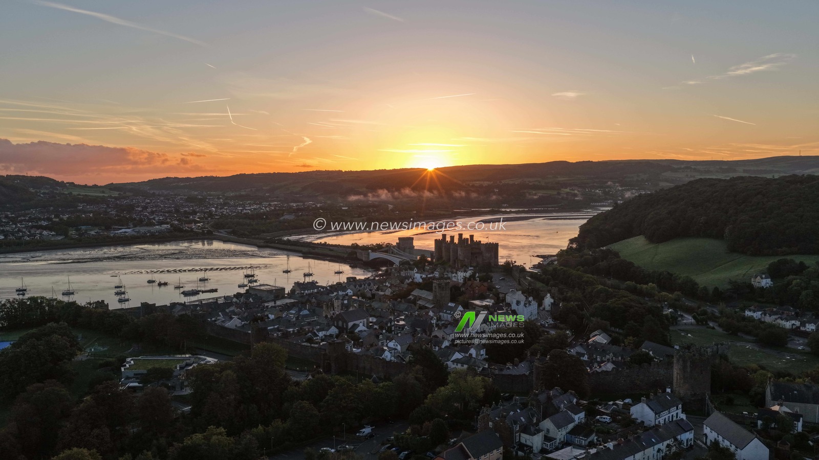 A spectacular sunrise breaks over the historic Conwy Castle, bathing the medieval fortress and surrounding landscape in dramatic golden light in Conwy, Wales, United Kingdom, on 3 October 2026.

(Photo by Mark Cosgrove/News Images)