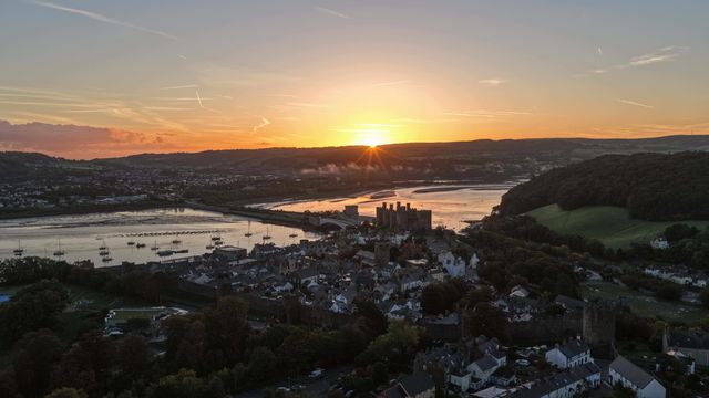 A spectacular sunrise breaks over the historic Conwy Castle, bathing the medieval fortress and surrounding landscape in dramatic golden light in Conwy, Wales, United Kingdom, on 3 October 2026.

(Photo by Mark Cosgrove/News Images)