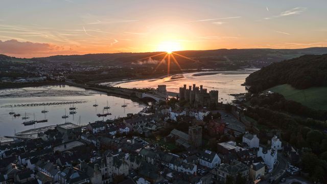 A spectacular sunrise breaks over the historic Conwy Castle, bathing the medieval fortress and surrounding landscape in dramatic golden light in Conwy, Wales, United Kingdom, on 3 October 2026.

(Photo by Mark Cosgrove/News Images)