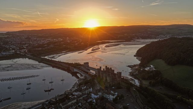 A spectacular sunrise breaks over the historic Conwy Castle, bathing the medieval fortress and surrounding landscape in dramatic golden light in Conwy, Wales, United Kingdom, on 3 October 2026.

(Photo by Mark Cosgrove/News Images)