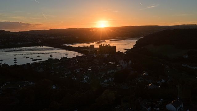 A spectacular sunrise breaks over the historic Conwy Castle, bathing the medieval fortress and surrounding landscape in dramatic golden light in Conwy, Wales, United Kingdom, on 3 October 2026.

(Photo by Mark Cosgrove/News Images)