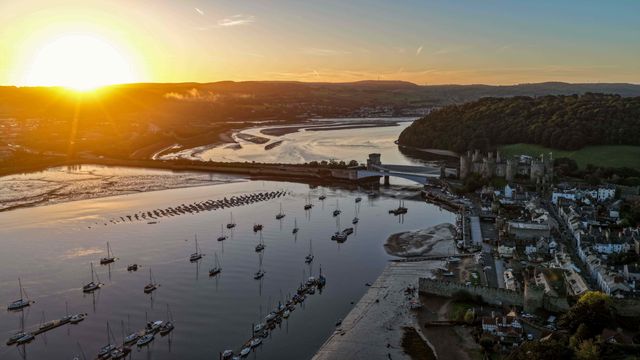 A spectacular sunrise breaks over the historic Conwy Castle, bathing the medieval fortress and surrounding landscape in dramatic golden light in Conwy, Wales, United Kingdom, on 3 October 2026.

(Photo by Mark Cosgrove/News Images)
