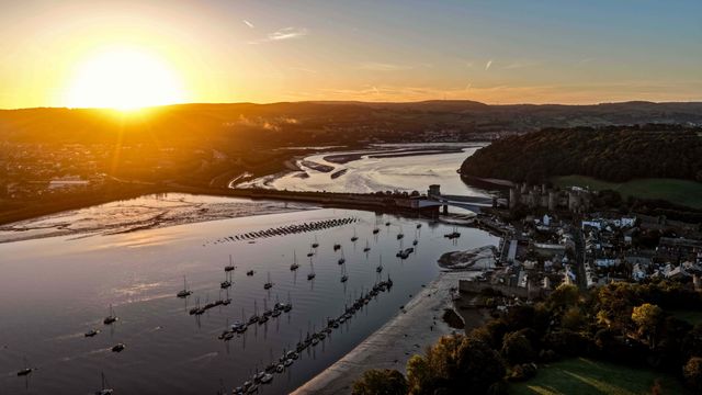 A spectacular sunrise breaks over the historic Conwy Castle, bathing the medieval fortress and surrounding landscape in dramatic golden light in Conwy, Wales, United Kingdom, on 3 October 2026.

(Photo by Mark Cosgrove/News Images)