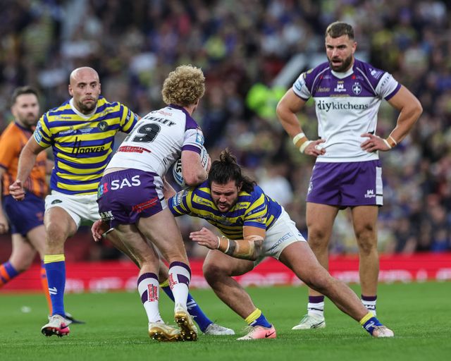 Lachlan Walmsley of Wakefield Trinity is tackled by James Bentley of Warrington Wolves during the Betfred Super League Grand Final match Warrington Wolves vs Wakefield Trinity at Old Trafford, Manchester, United Kingdom on 03 October 2026

(Photo by Mark Cosgrove/News Images