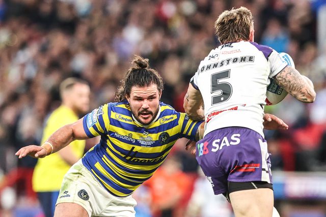 Tom Johnstone of Wakefield Trinity is tackled by James Bentley of Warrington Wolves during the Betfred Super League Grand Final match Warrington Wolves vs Wakefield Trinity at Old Trafford, Manchester, United Kingdom on 03 October 2026

(Photo by Alfie Cosgrove/News Images)