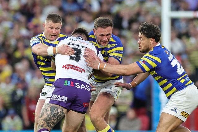 Cameron Scott of Wakefield Trinity is tackled by Luke Yates of Warrington Wolves Ben Currie of Warrington Wolves and Joe Philbin of Warrington Wolves during the Betfred Super League Grand Final match Warrington Wolves vs Wakefield Trinity at Old Trafford, Manchester, United Kingdom on 03 October 2026

(Photo by Mark Cosgrove/News Images)