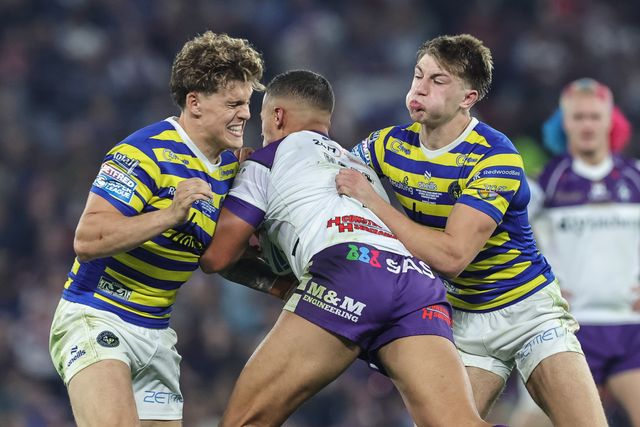 Corey Hall of Wakefield Trinity is tackled by Arron Lindop of Warrington Wolves and Ewan Irwin of Warrington Wolves during the Betfred Super League Grand Final match Warrington Wolves vs Wakefield Trinity at Old Trafford, Manchester, United Kingdom on 03 October 2026

(Photo by Mark Cosgrove/News Images)