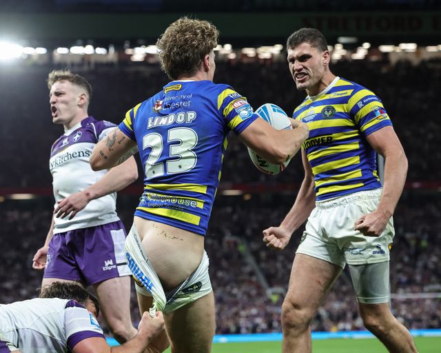 Arron Lindop of Warrington Wolves celebrates his try with teammates during the Betfred Super League Grand Final match Warrington Wolves vs Wakefield Trinity at Old Trafford, Manchester, United Kingdom on 03 October 2026

(Photo by Mark Cosgrove/News Images)