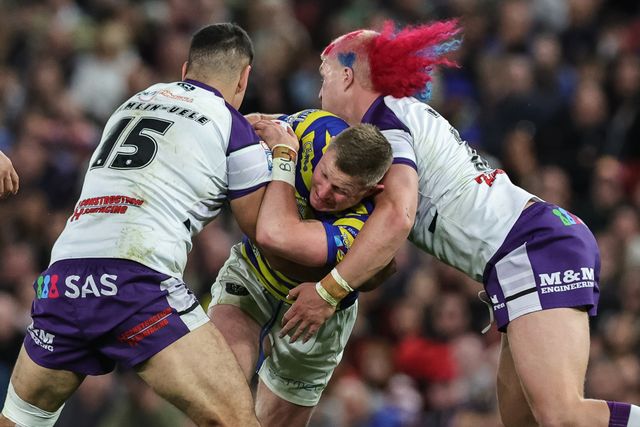 Luke Yates of Warrington Wolves is tackled by Caleb Hamlin-Uele of Wakefield Trinity and Caius Faatili of Wakefield Trinity during the Betfred Super League Grand Final match Warrington Wolves vs Wakefield Trinity at Old Trafford, Manchester, United Kingdom on 03 October 2026

(Photo by Mark Cosgrove/News Images)