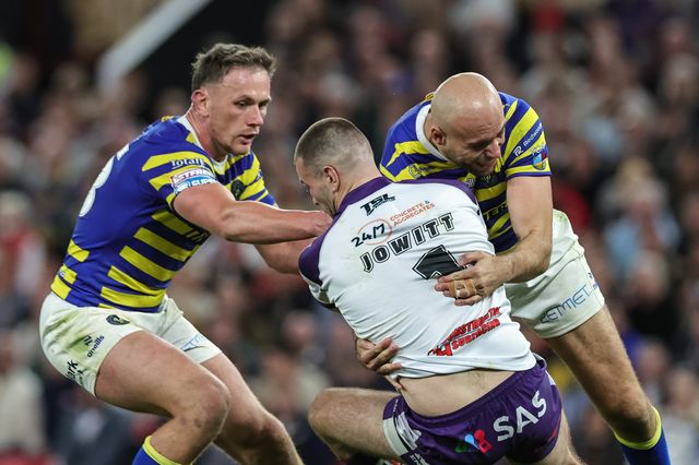 Max Jowitt of Wakefield Trinity is tackled by James Harrison of Warrington Wolves and Ben Currie of Warrington Wolves during the Betfred Super League Grand Final match Warrington Wolves vs Wakefield Trinity at Old Trafford, Manchester, United Kingdom on 03 October 2026

(Photo by Mark Cosgrove/News Images)