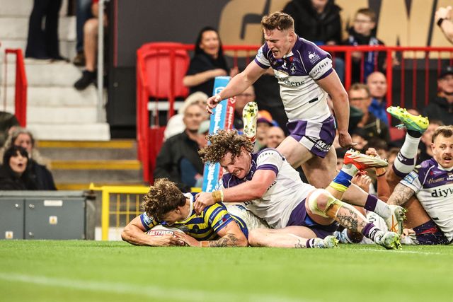 Arron Lindop of Warrington Wolves goes over for a try during the Betfred Super League Grand Final match Warrington Wolves vs Wakefield Trinity at Old Trafford, Manchester, United Kingdom on 03 October 2026

(Photo by Alfie Cosgrove/News Images)