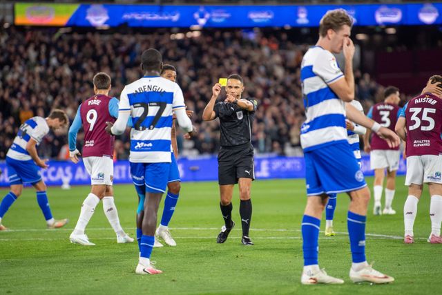 Amadou Mbengue of QPR receives a yellow card for a foul on Pablo of West Ham United during the Sky Bet Championship match West Ham United vs Queens Park Rangers at London Stadium, London, United Kingdom on 09 October 2026

(Photo by Mike Turner/News Images)