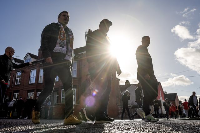 Manchester United fans make their way to Old Trafford during the Premier League match Manchester United vs Tottenham Hotspur at Old Trafford, Manchester, United Kingdom on 10 October 2026

(Photo by Mark Cosgrove/News Images)