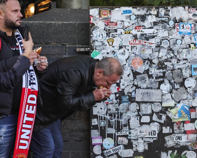 Manchester United fans grab a bite to eat during the Premier League match Manchester United vs Tottenham Hotspur at Old Trafford, Manchester, United Kingdom on 10 October 2026

(Photo by Mark Cosgrove/News Images)
