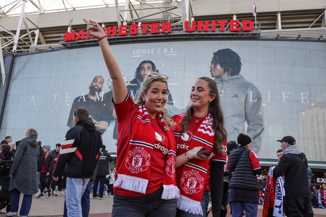Manchester United fans pose for a selfie during the Premier League match Manchester United vs Tottenham Hotspur at Old Trafford, Manchester, United Kingdom on 10 October 2026

(Photo by Mark Cosgrove/News Images)