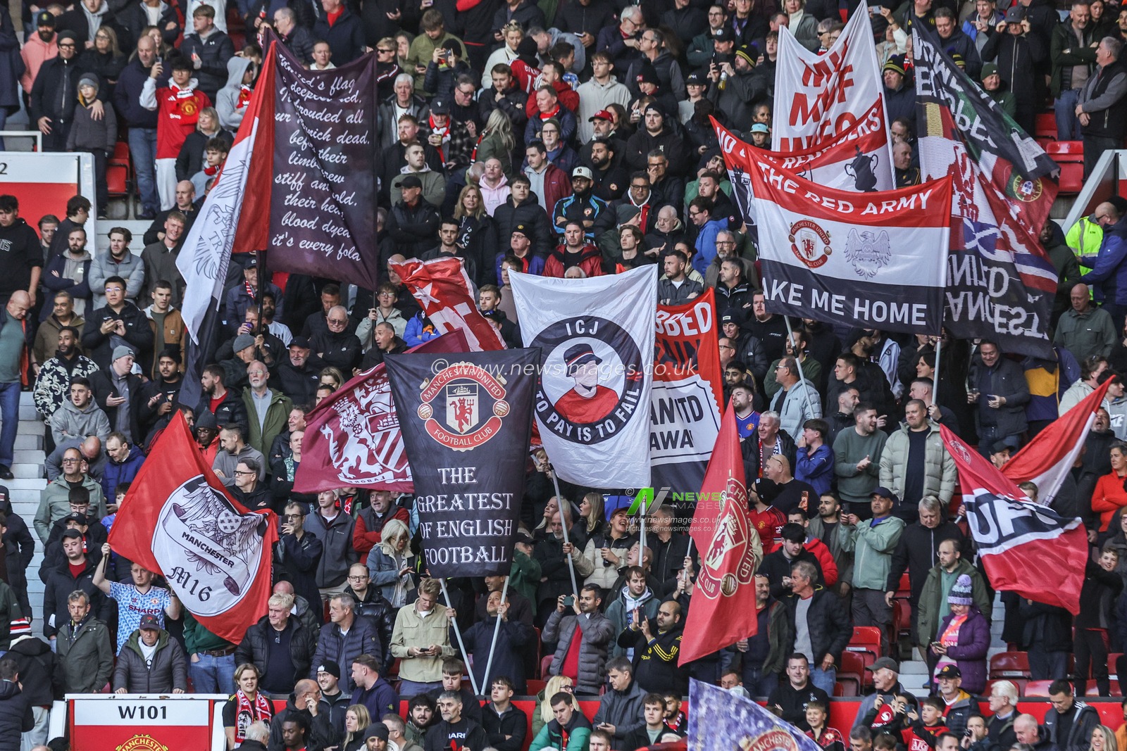 Manchester United fans hold up flags before the Premier League match Manchester United vs Tottenham Hotspur at Old Trafford, Manchester, United Kingdom on 10 October 2026

(Photo by Mark Cosgrove/News Images)