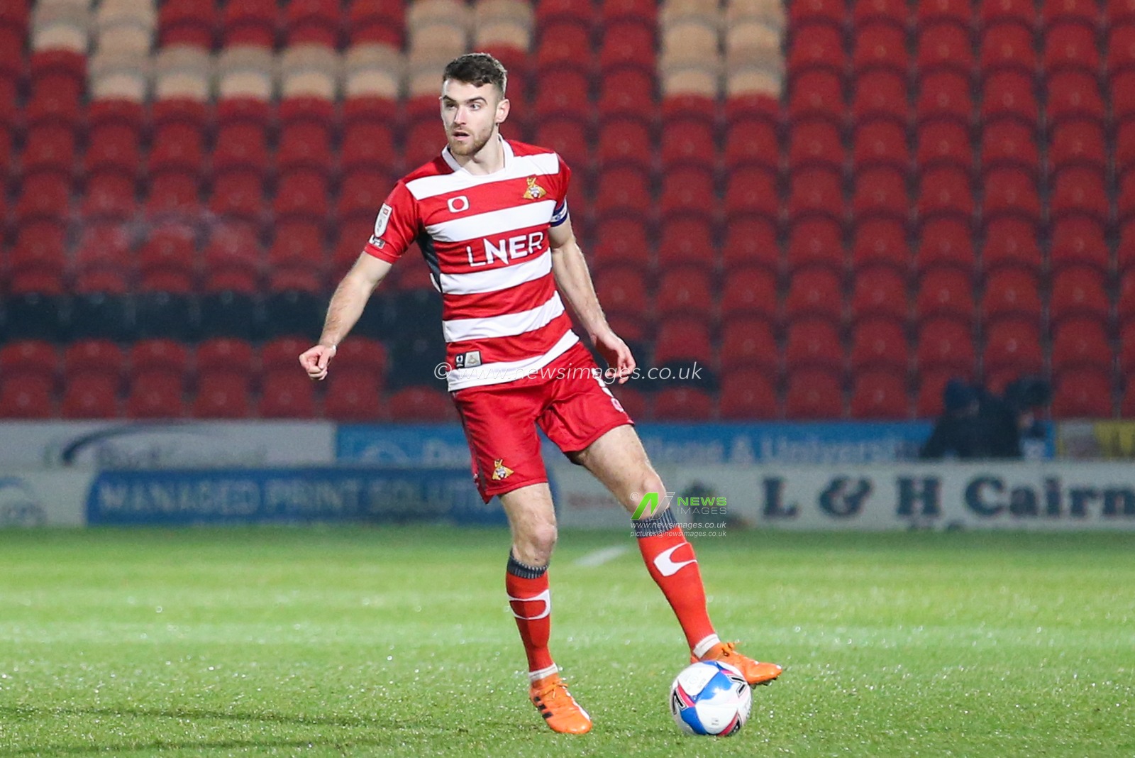 Ben Whiteman #8 of Doncaster Rovers in action during the game