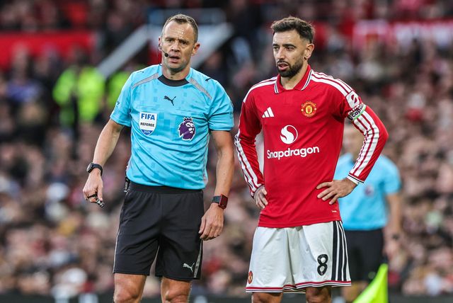 Referee Stuart Attwell has a chat with Bruno Fernandes of Manchester United during the Premier League match Manchester United vs Tottenham Hotspur at Old Trafford, Manchester, United Kingdom on 10 October 2026

(Photo by Mark Cosgrove/News Images)